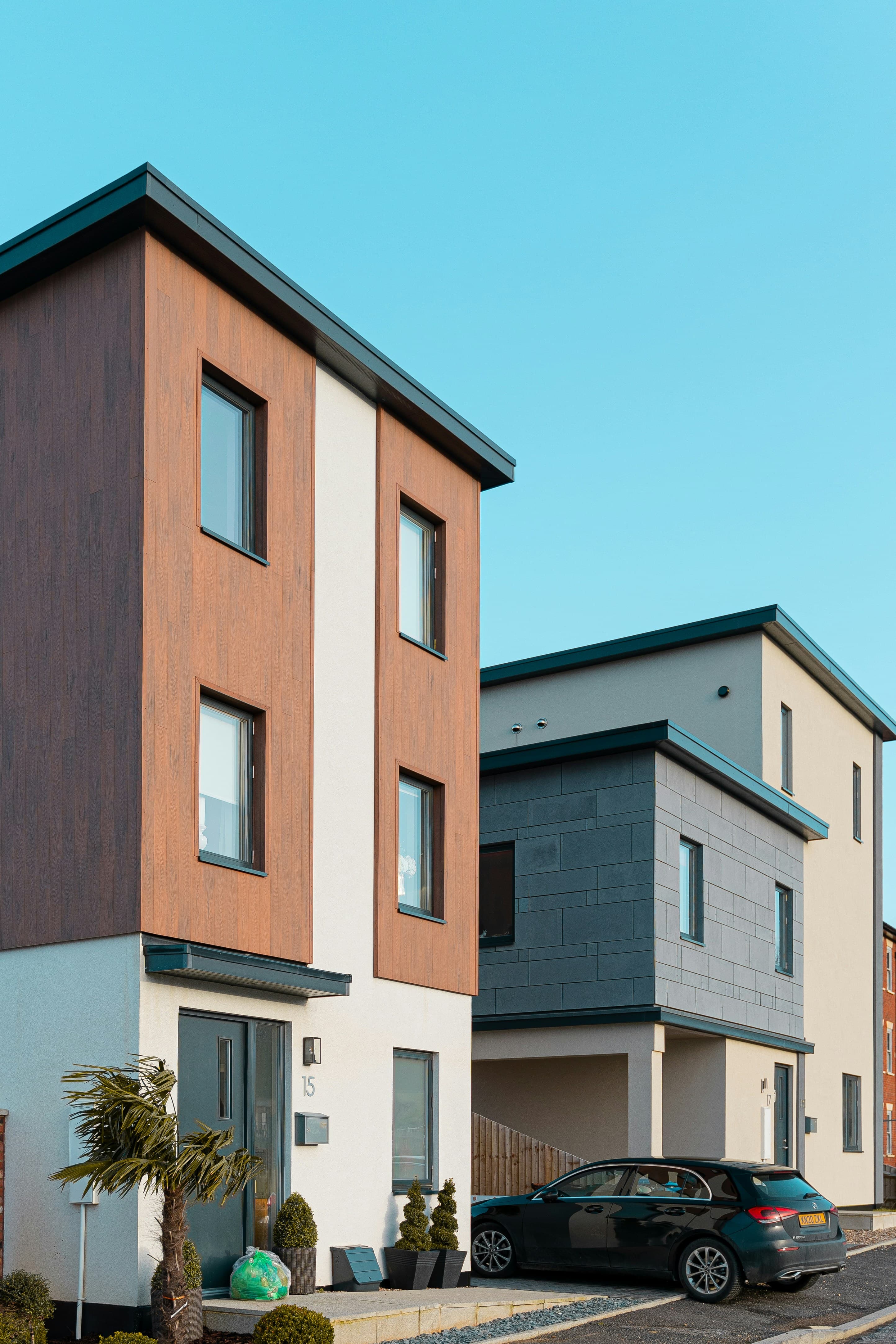 Modern homes beneath a clear blue sky